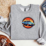 a grey sweatshirt with a blue car on it