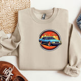 a sweater with a picture of a car on it