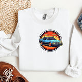 a white sweatshirt with a blue car on it