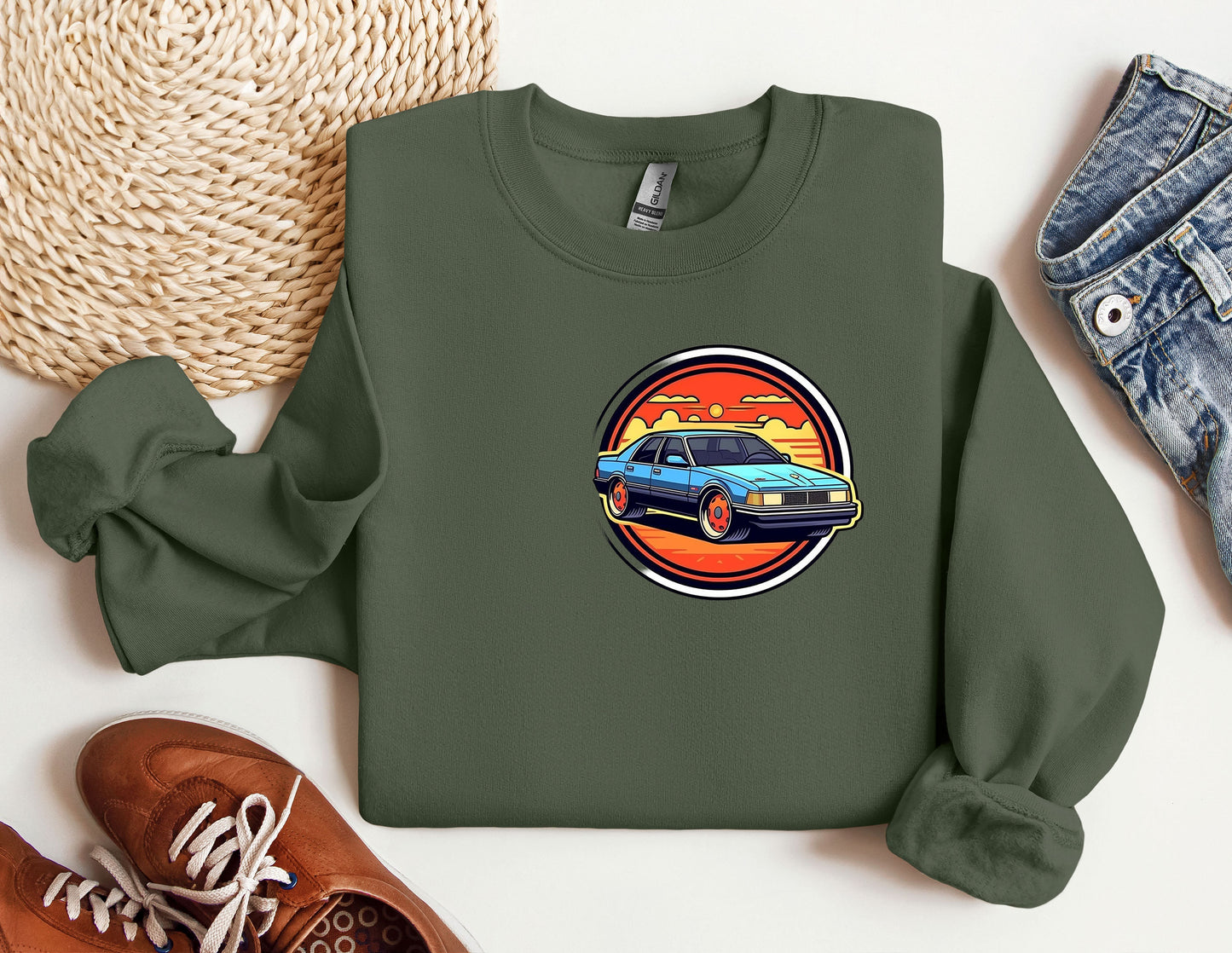 a green sweatshirt with a picture of a car on it