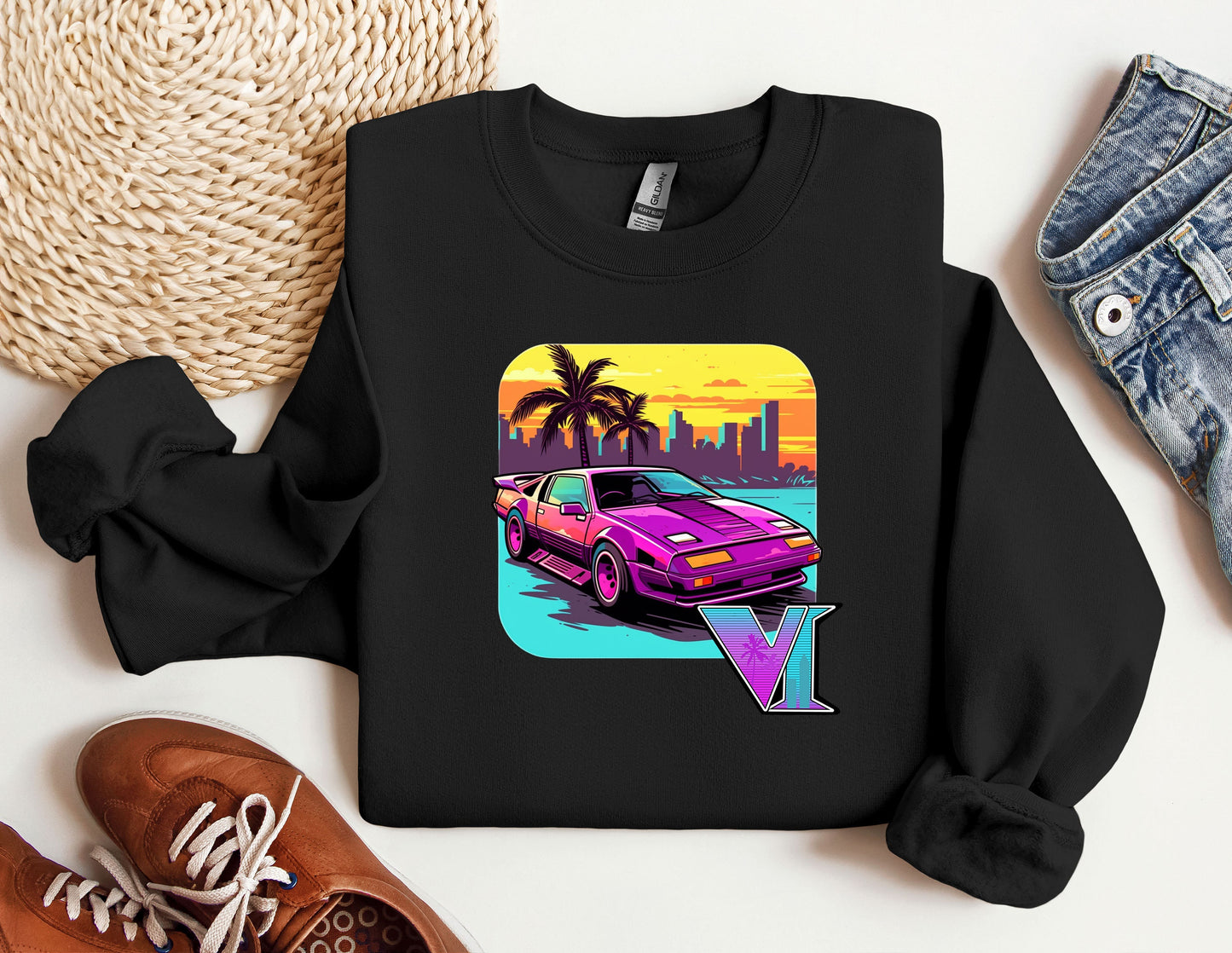 a black shirt with a pink car on it