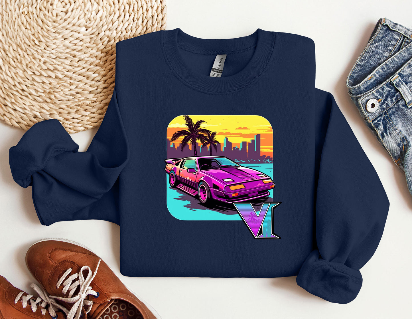 a blue shirt with a pink car on it