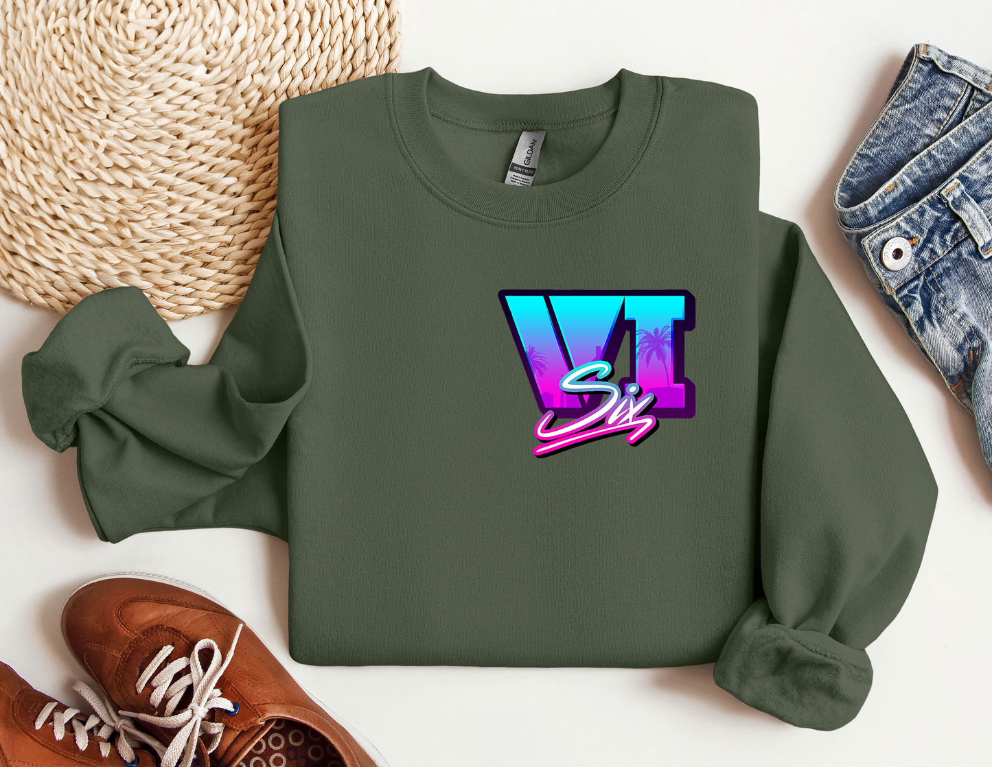 a sweatshirt with the letter v on it next to a pair of shoes