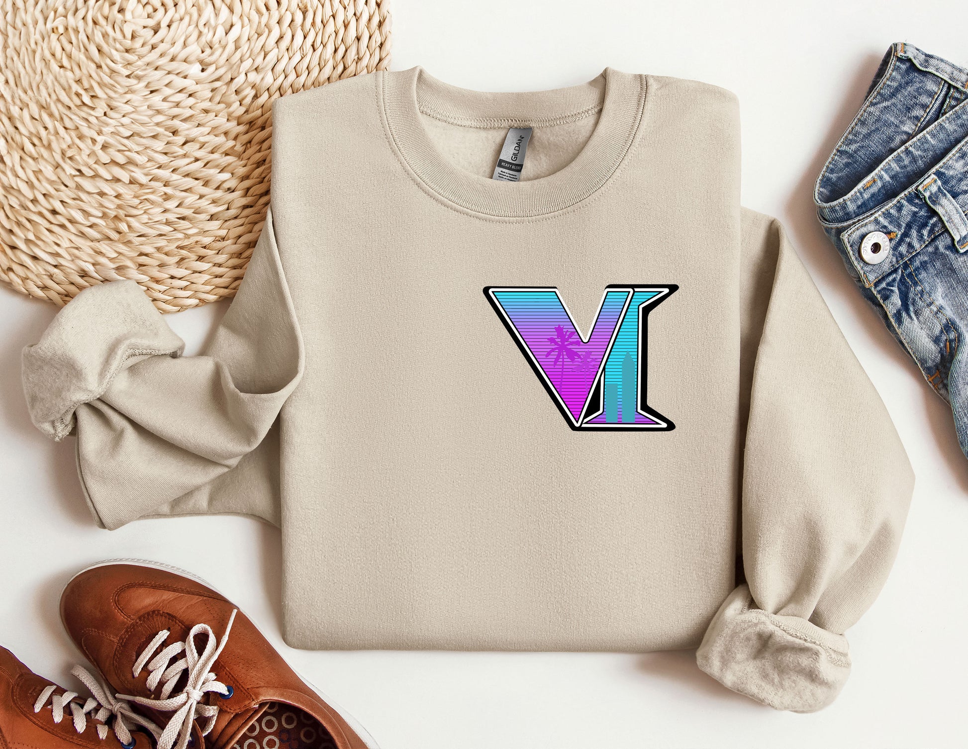 a sweater with the letter v on it next to a pair of shoes