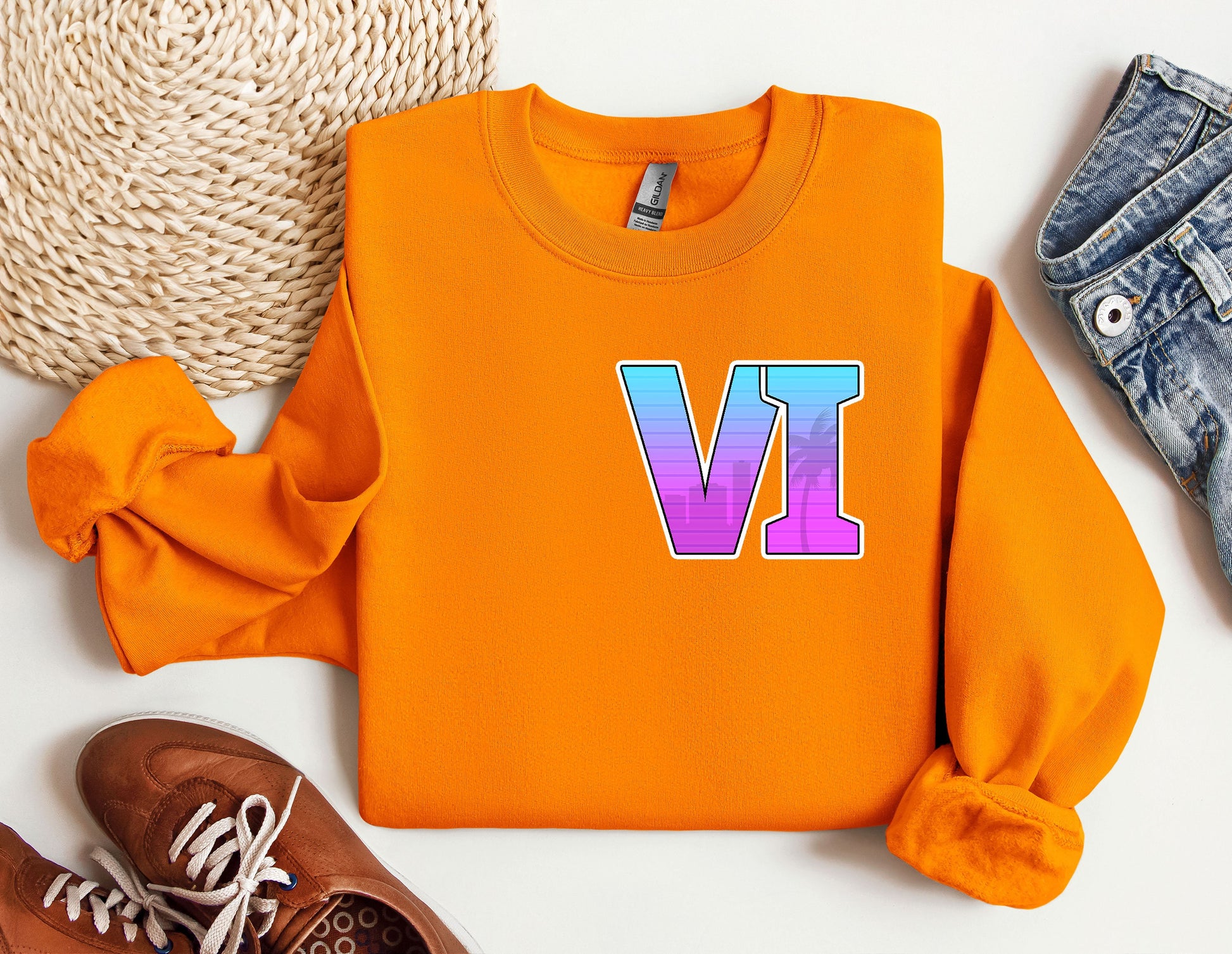 an orange sweatshirt with the letter v on it