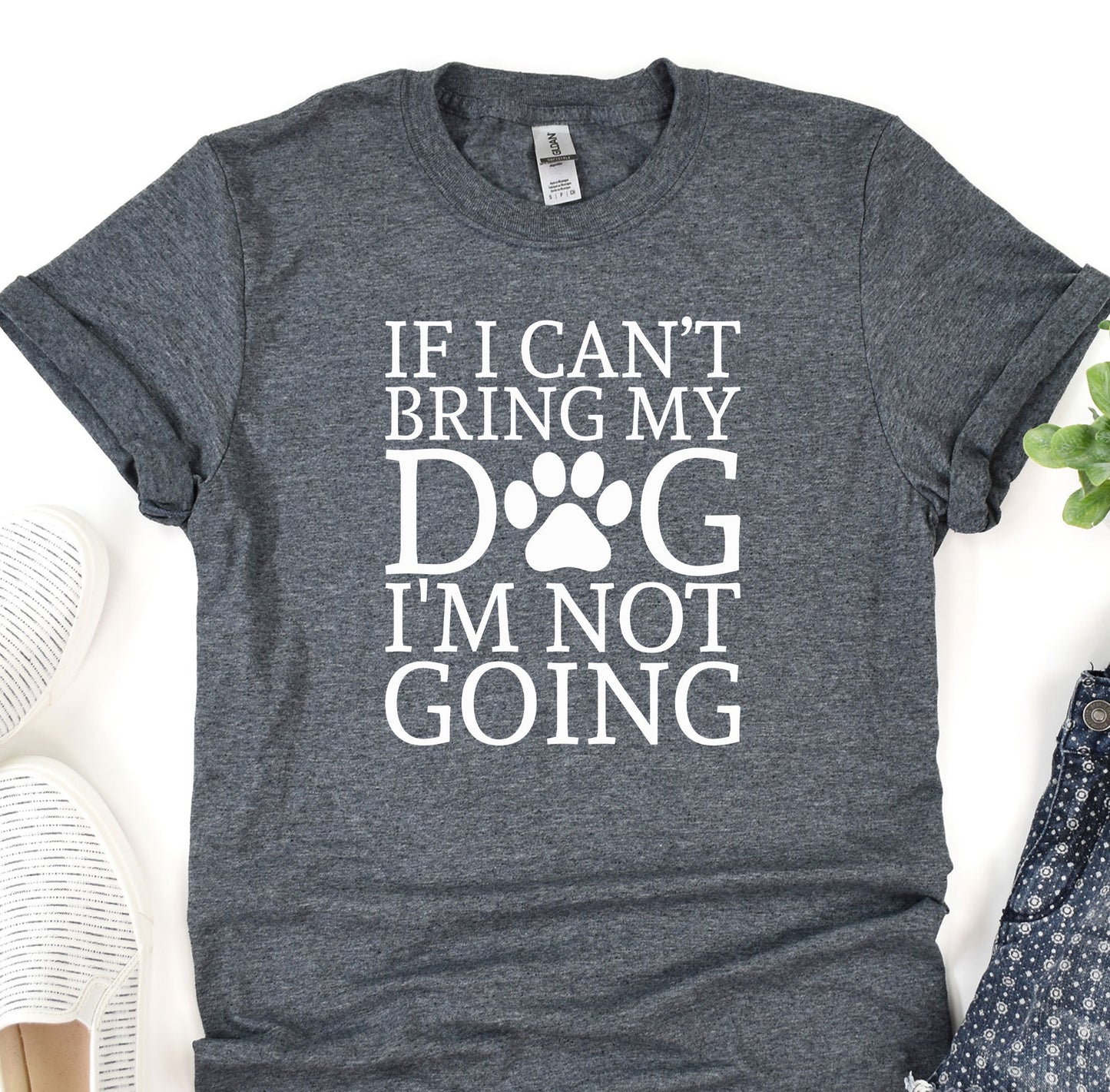 a t - shirt that says if i can&#39;t bring my dog i &#39;