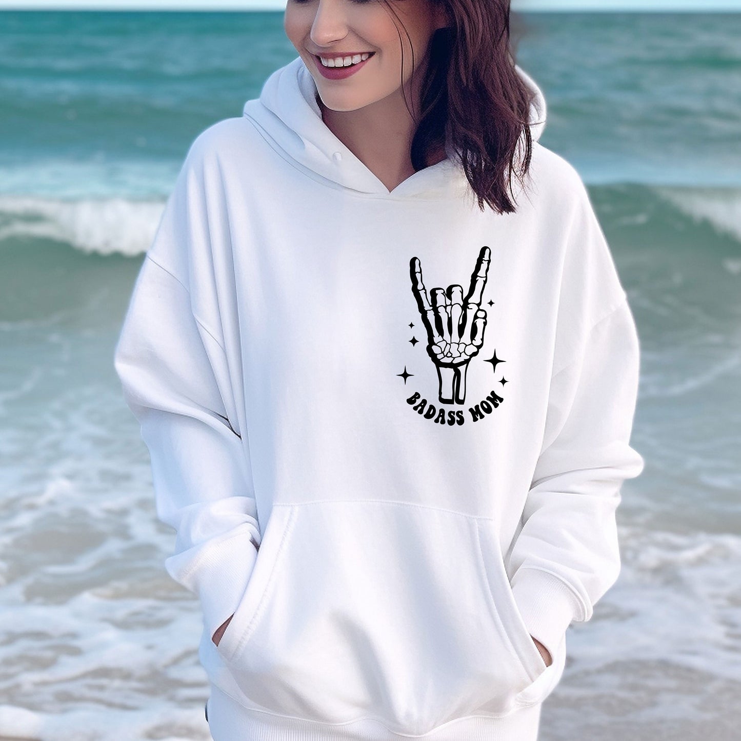 a woman wearing a white hoodie with a peace sign on it