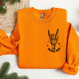 an orange sweatshirt with a hand drawn on it