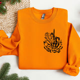 an orange sweatshirt with a picture of the eiffel tower on it