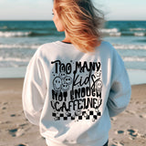 a woman standing on a beach with her back to the camera