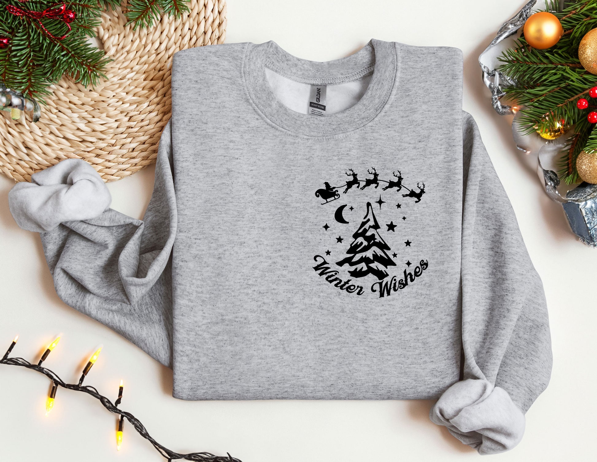 a grey sweatshirt with a christmas tree and santa&#39;s sleigh on it