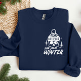 a blue sweater with a picture of a person wearing sunglasses