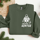 a green sweater with a skull and a hat on it