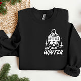 a black sweater with a skull and a hat on it