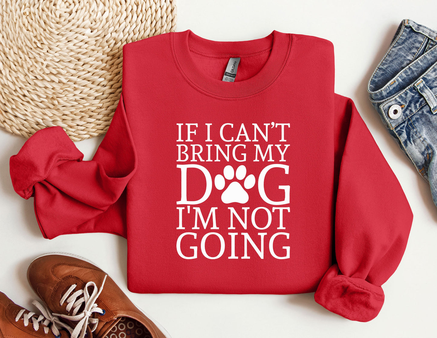 a red sweatshirt with a dog&#39;s paw on it