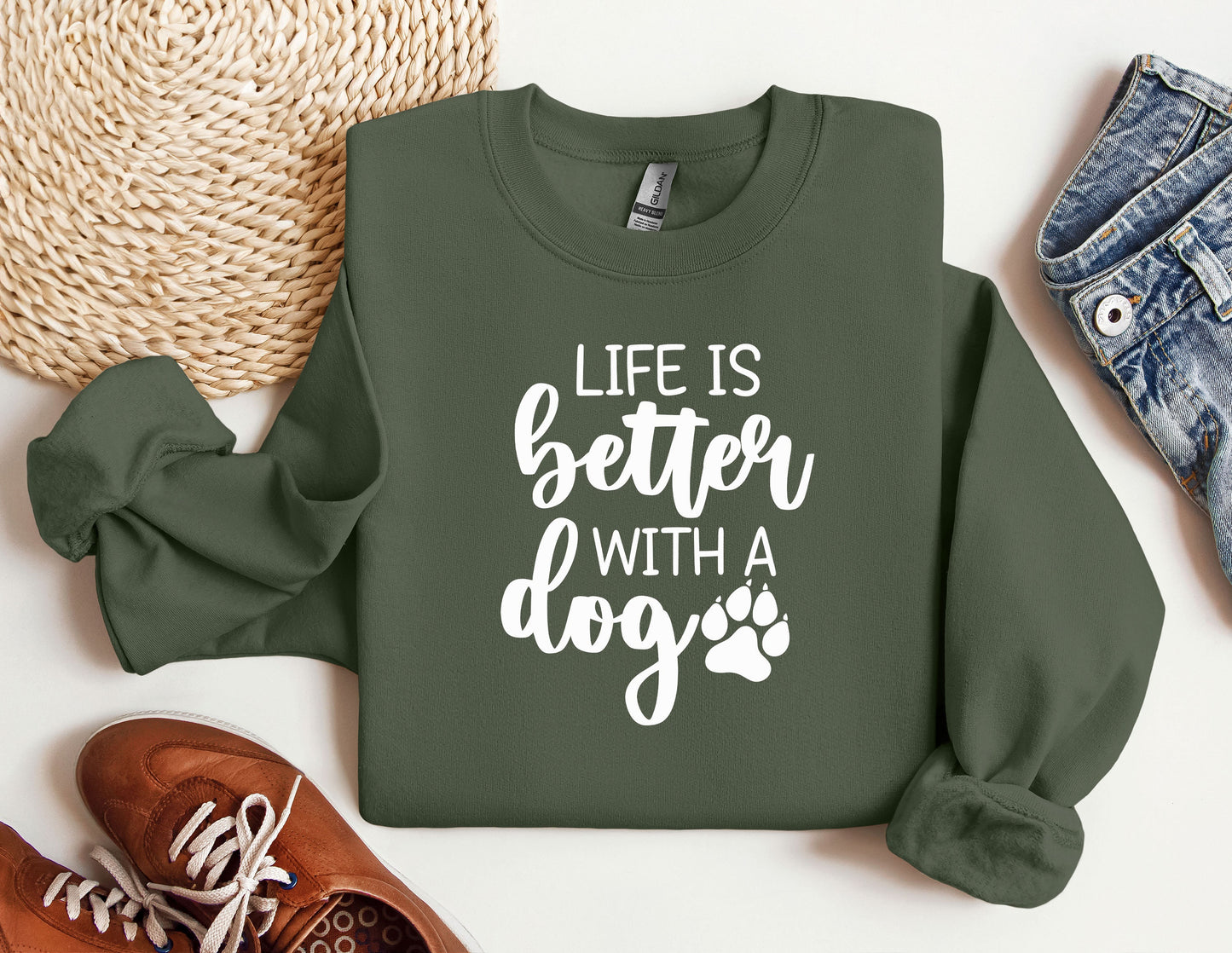 a green sweatshirt with the words life is better with a dog on it