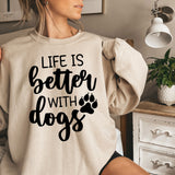 a woman wearing a sweatshirt that says life is better with dogs
