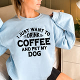 a woman sitting on a bed wearing a blue sweatshirt