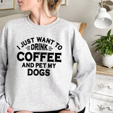 a woman wearing a sweatshirt that says i just want to drink coffee and pet my