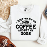 a white sweatshirt with a black print that says i just want to drink coffee and