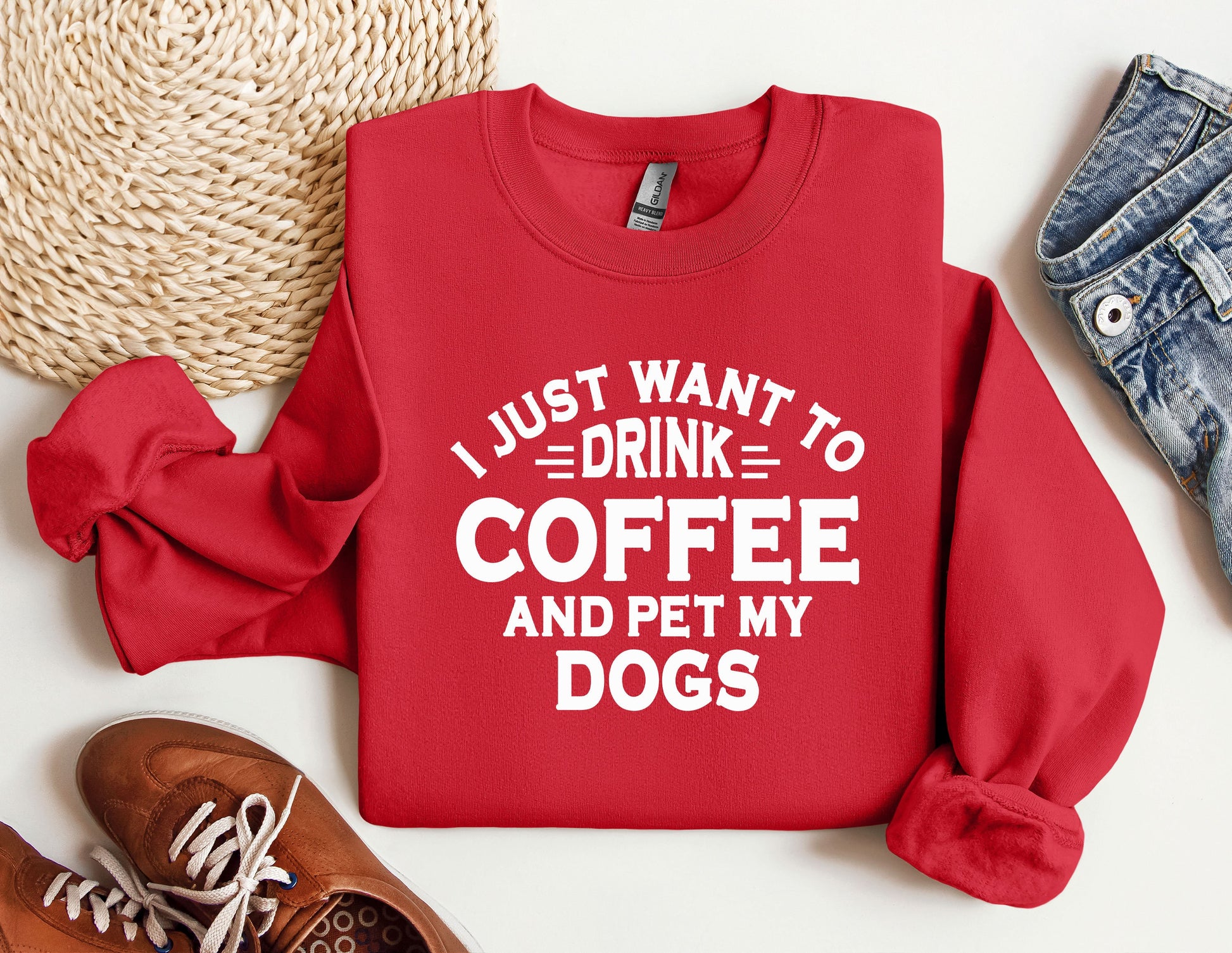 a red sweatshirt that says i just want to drink coffee and pet my dogs