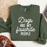 a green sweatshirt that says dogs are my favorite people
