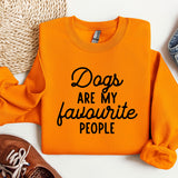 a pair of shoes and an orange sweatshirt with the words dogs are my favorite people