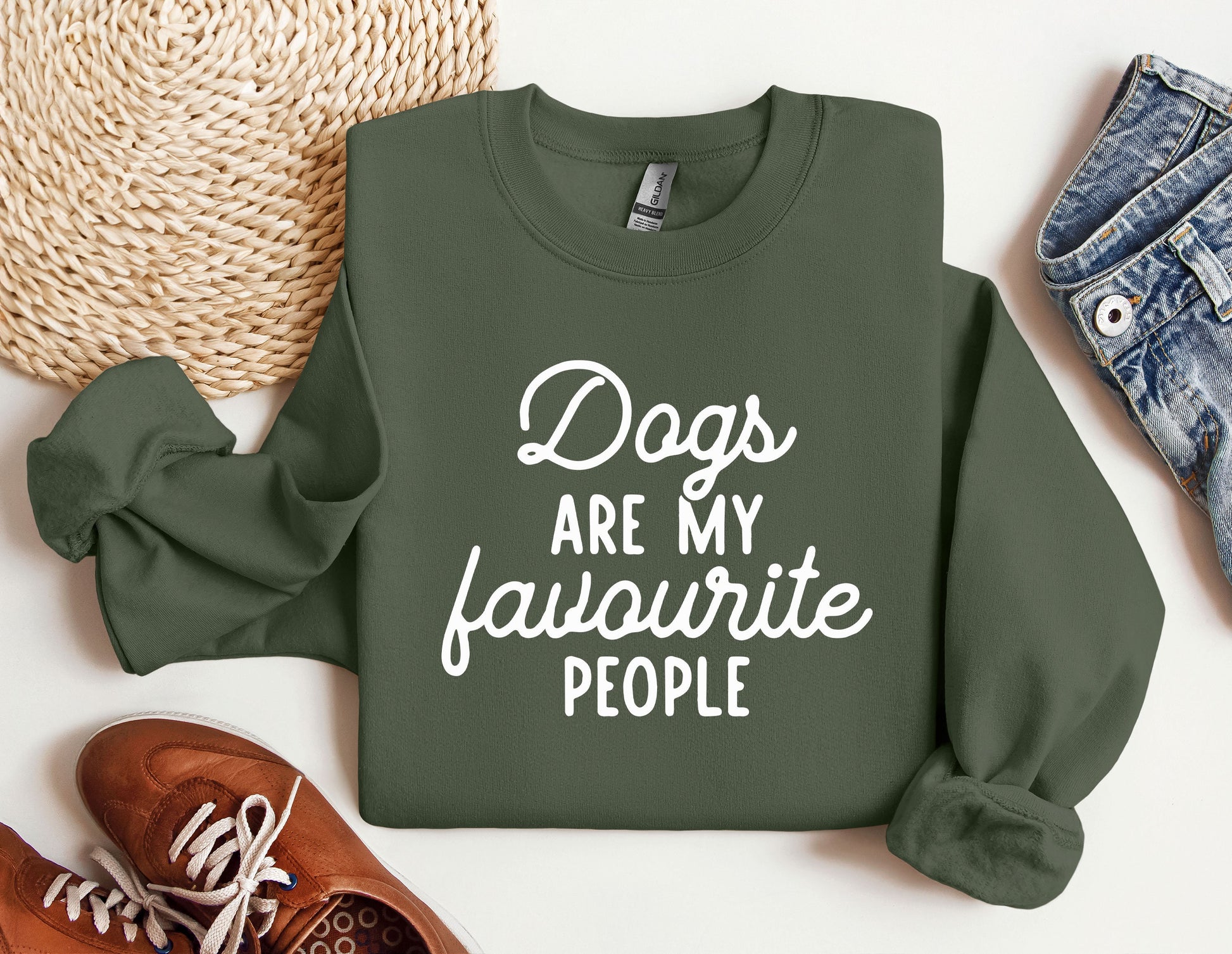 a green sweatshirt that says dogs are my favorite people