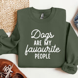 a green sweatshirt that says dogs are my favorite people