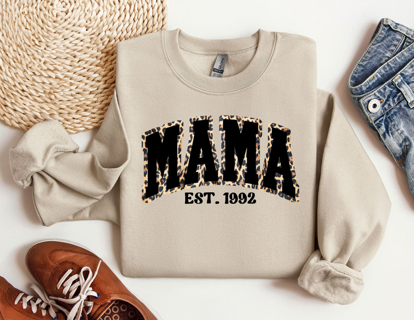 a sweater with the word mama on it next to a pair of shoes