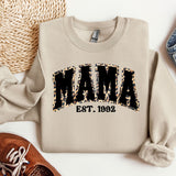 a sweater with the word mama on it next to a pair of shoes
