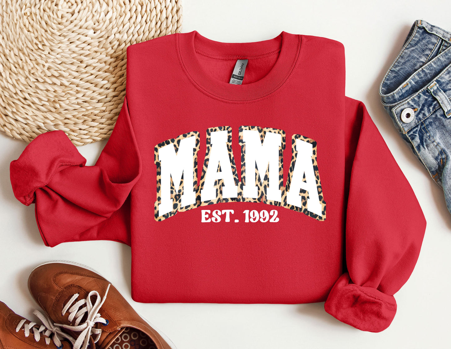 a red sweatshirt with the word mama printed on it