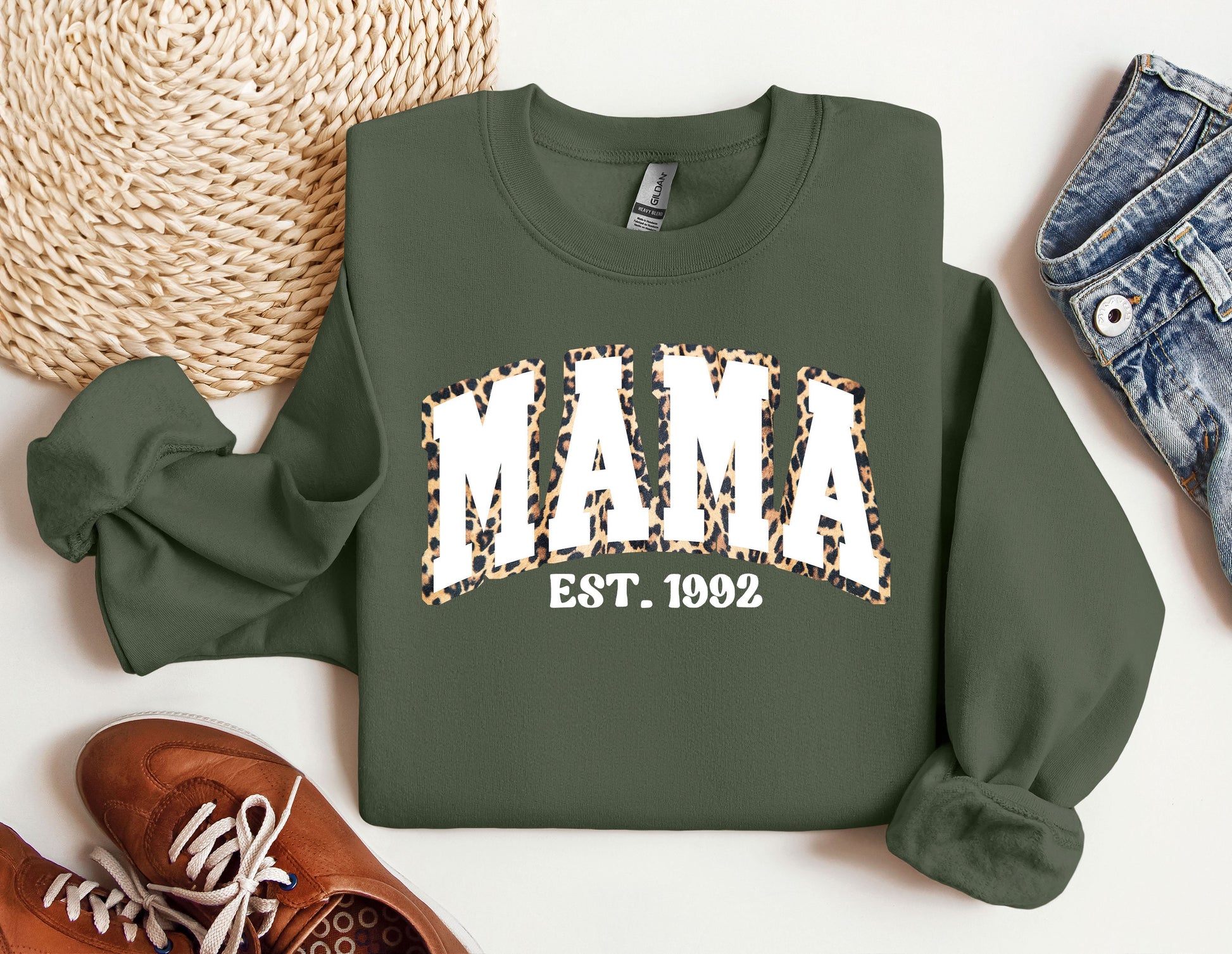 a green sweatshirt with the word mama printed on it