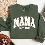 a green sweatshirt with the word mama printed on it