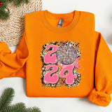 an orange shirt with a pink and black design on it