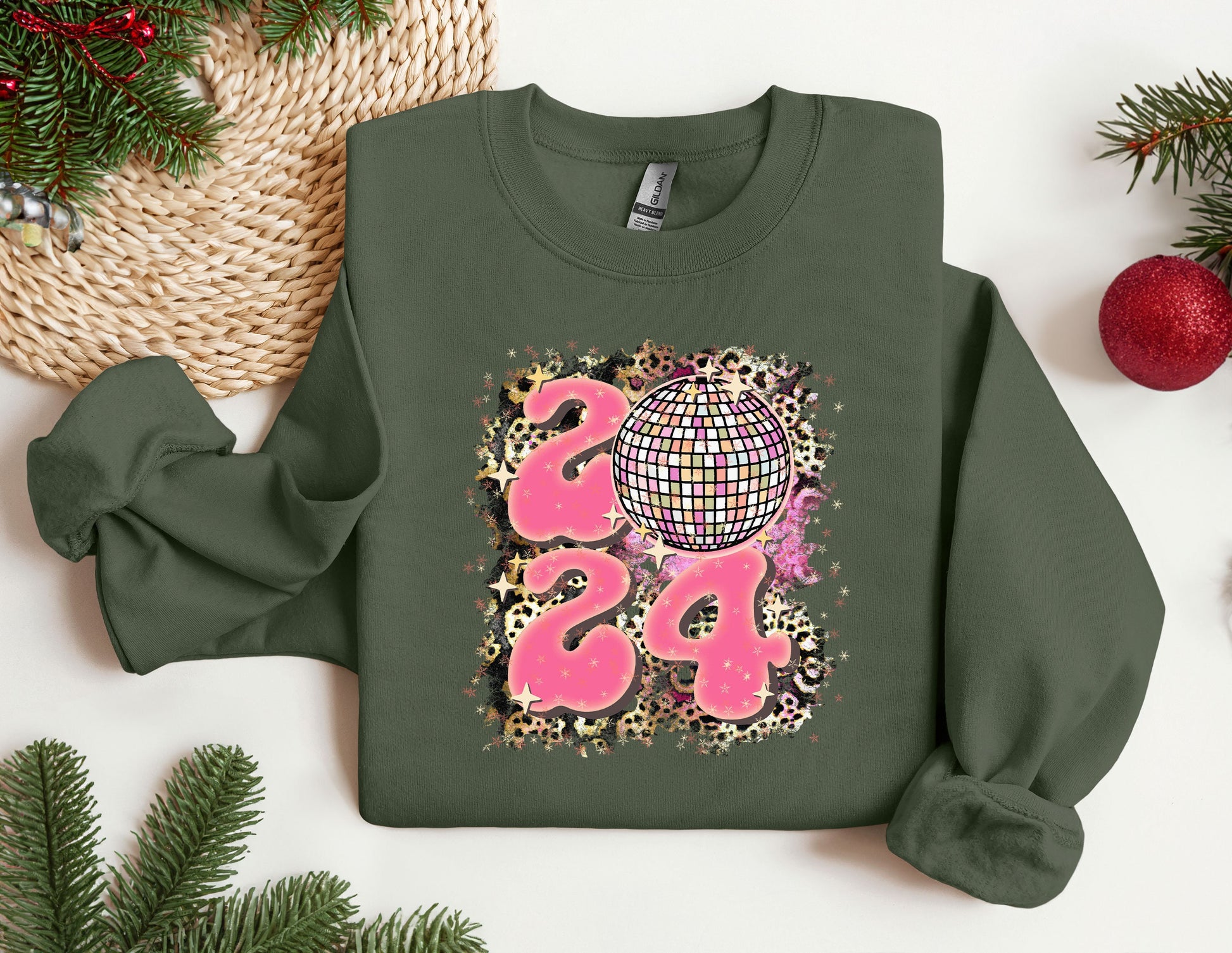 a green sweatshirt with a disco ball on it