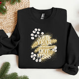 a black shirt with gold glitter and a kiss on the lips