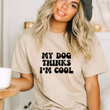 a woman wearing a t - shirt that says, my dog thinks i'm