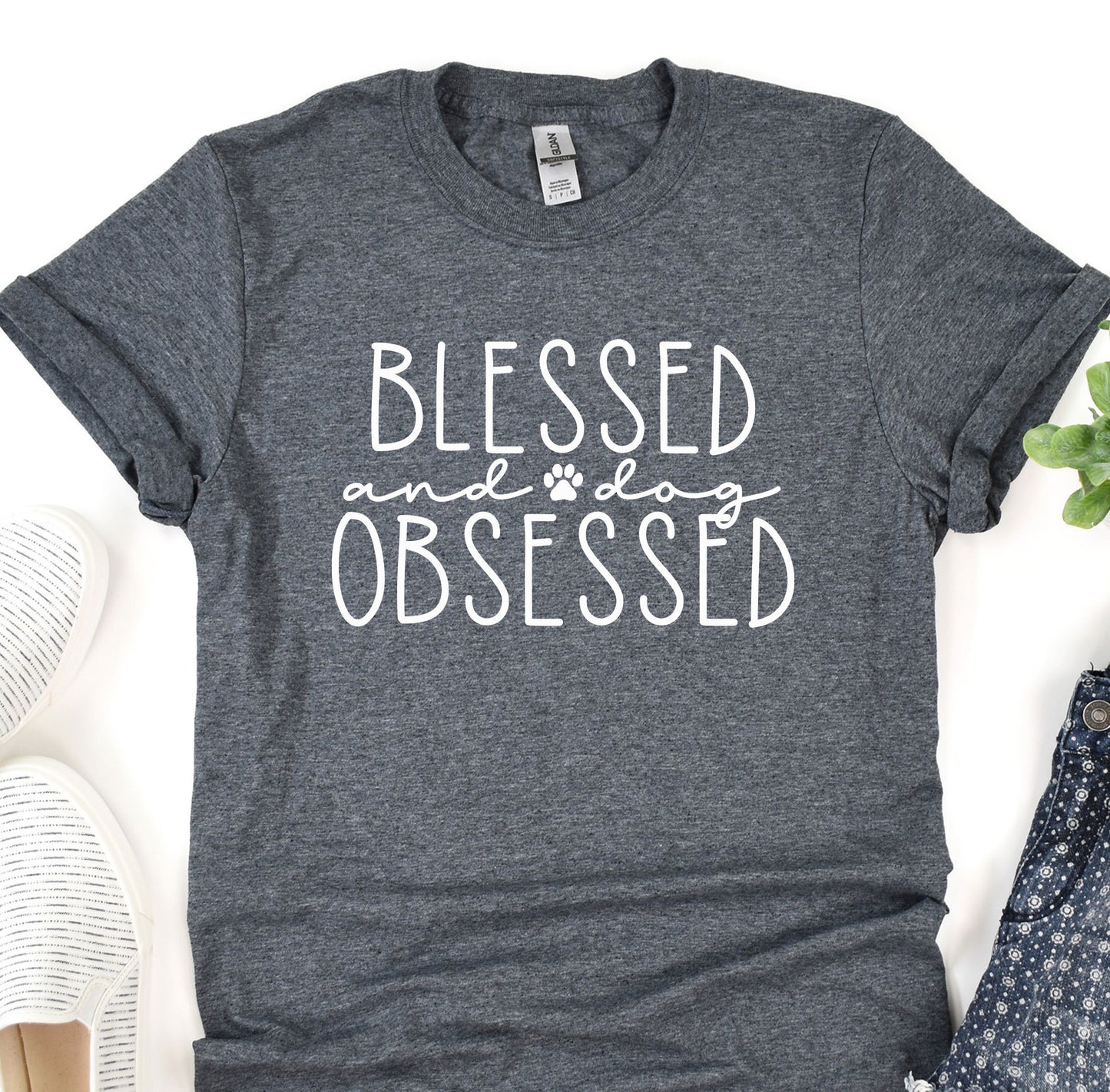 a t - shirt that says, blessed and a paw print on it