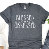 a t - shirt that says, blessed and a paw print on it