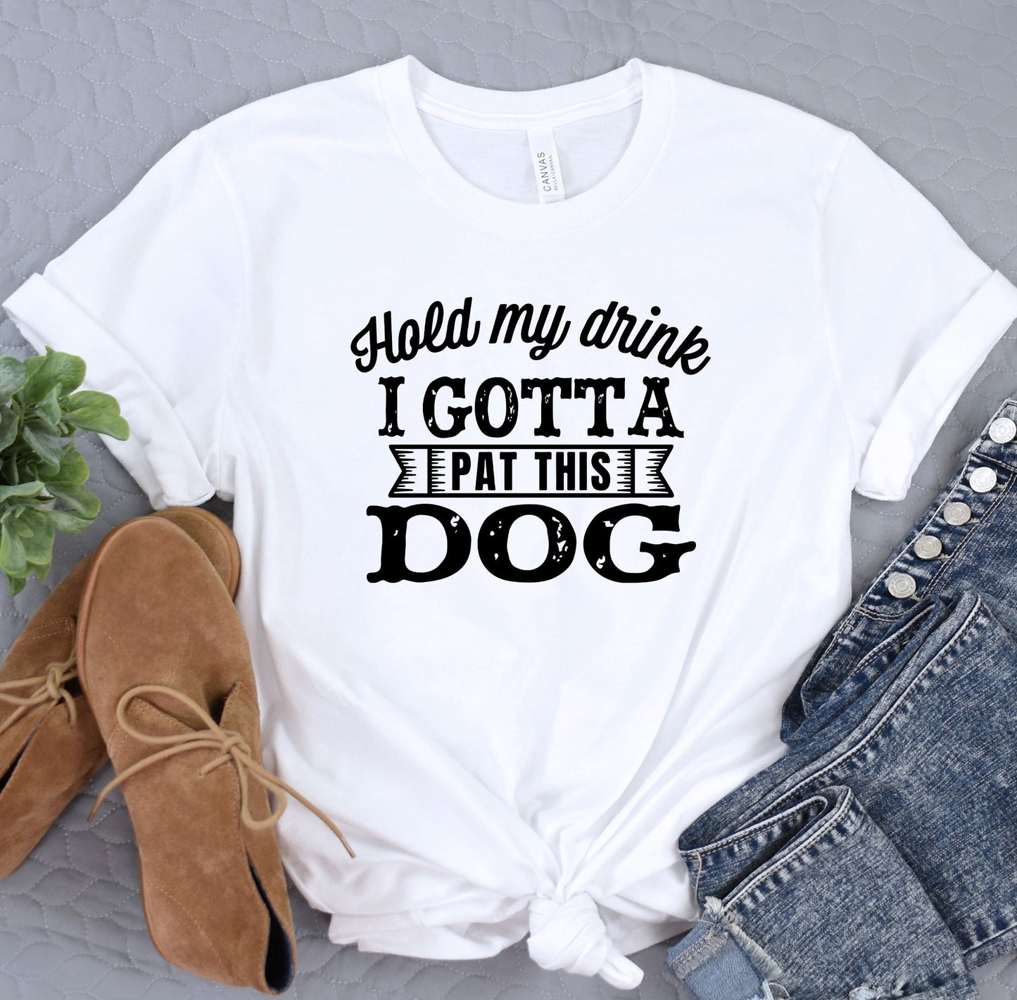 a white t - shirt that says i gota eat this dog