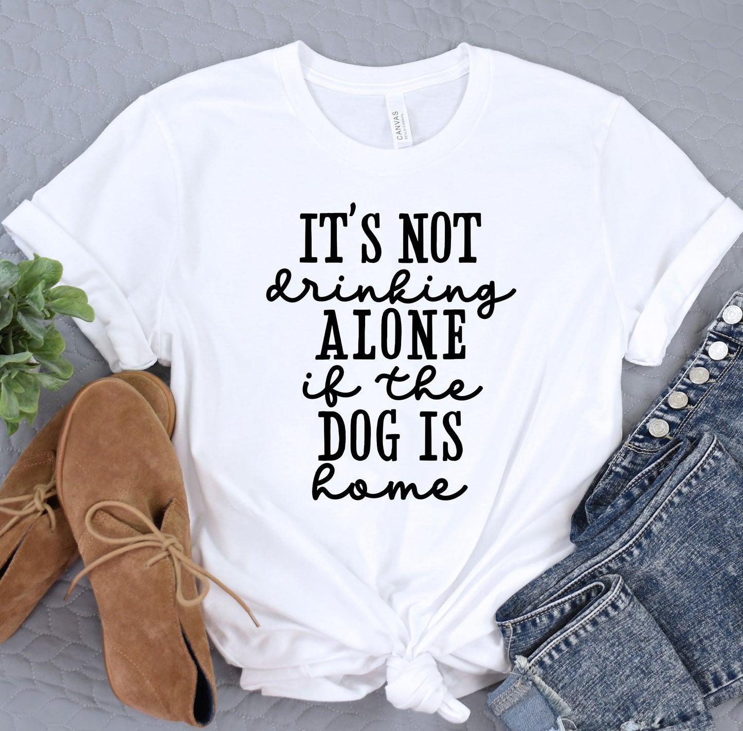 a t - shirt that says it&#39;s not drinking alone and the dog is