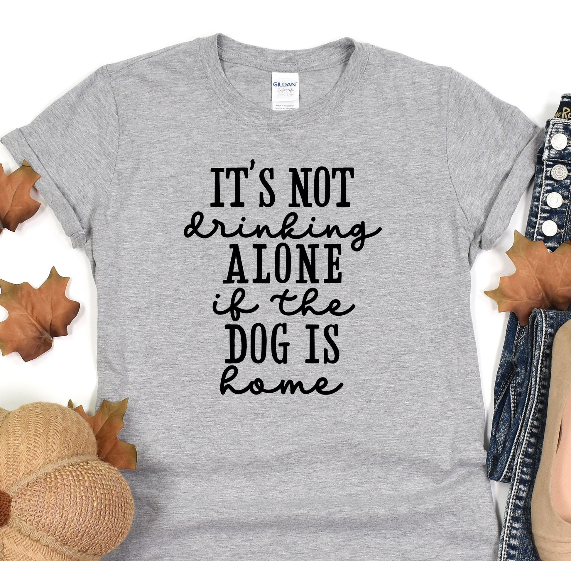 a t - shirt that says it&#39;s not drinking alone if the dog is