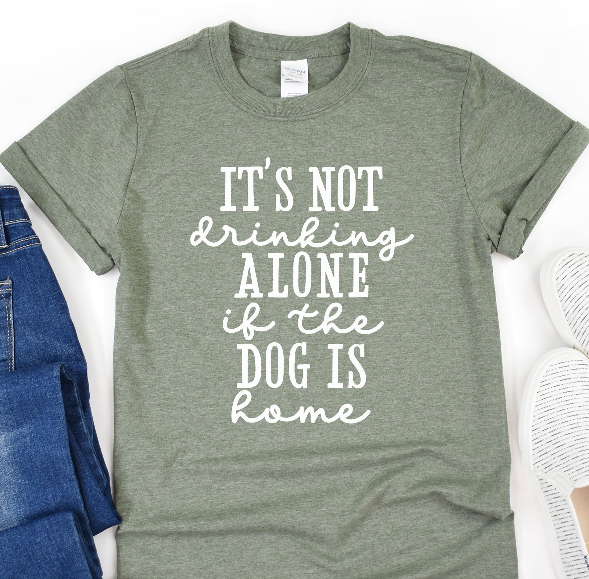 a t - shirt that says it&#39;s not drinking alone if the dog is