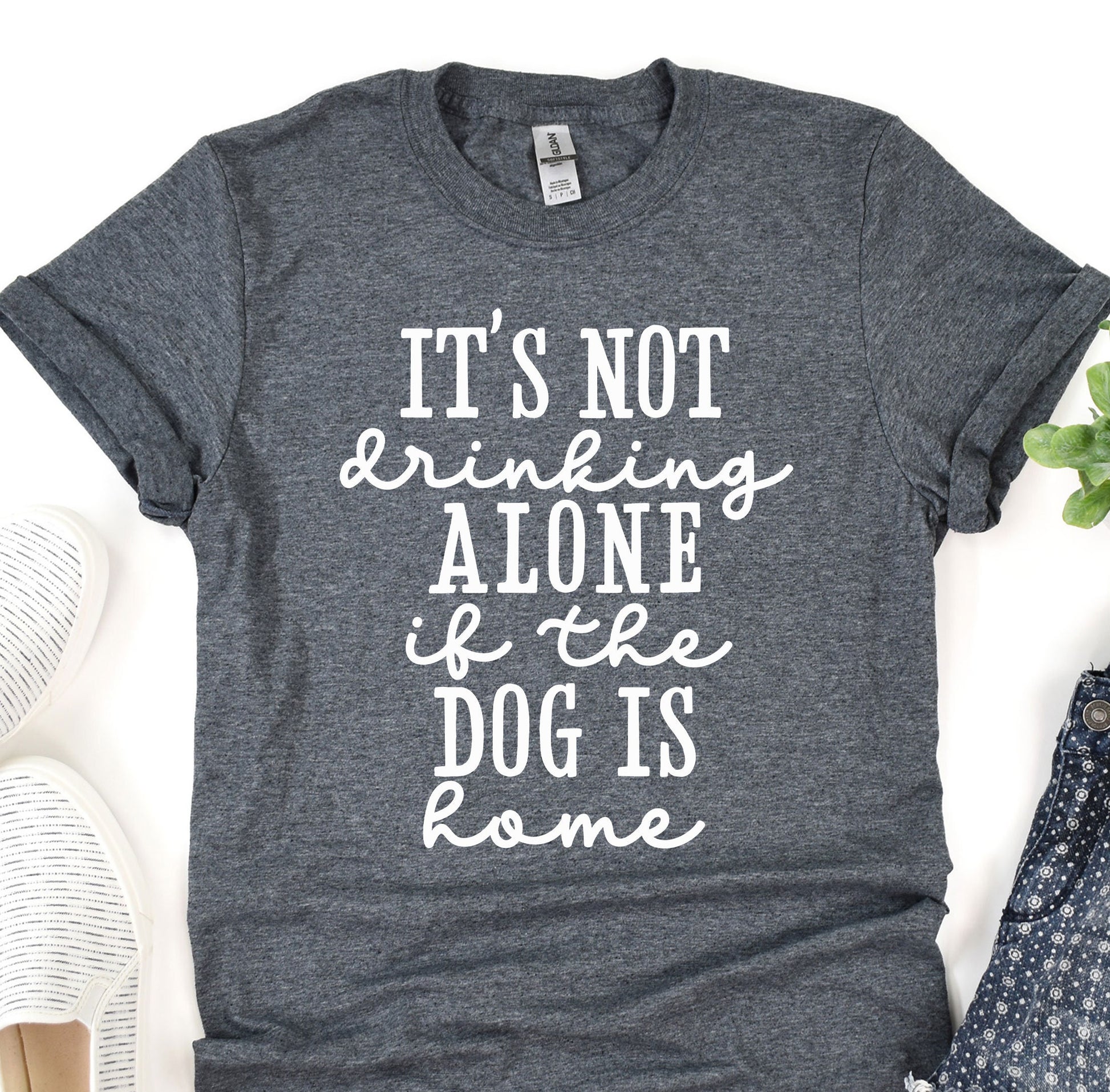 a t - shirt that says it&#39;s not drinking alone of the dog is