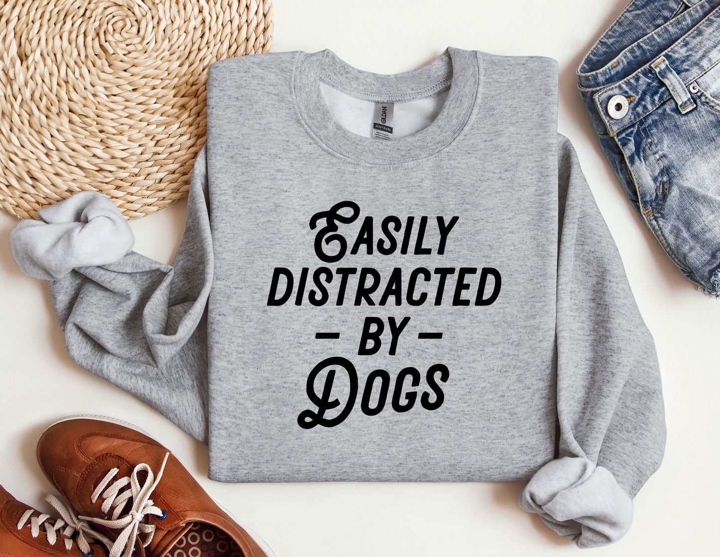 a sweatshirt that says easily distracted by dogs