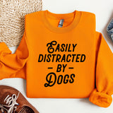 an orange sweatshirt that says easily distracted by dogs