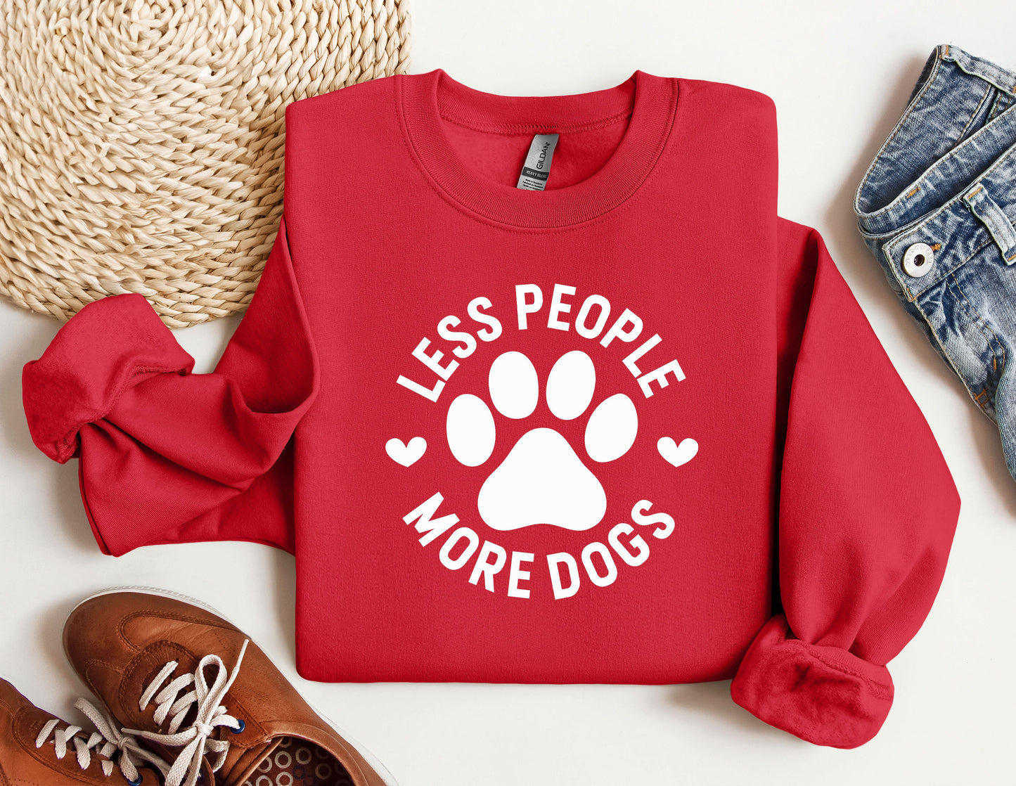 a red sweatshirt that says less people more dogs