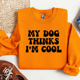 an orange sweatshirt that says, my dog thinks i'm cool