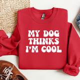 a red sweatshirt that says, my dog thinks i'm cool